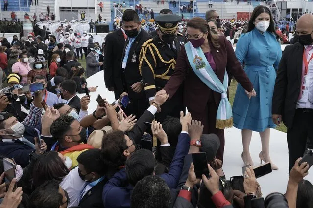 President Xiomara Castro greets supporters during her inauguration as Honduras' first female president at the National stadium in Tegucigalpa, Honduras, Thursday, January 27, 2022. (Photo by Moises Castillo/AP Photo)