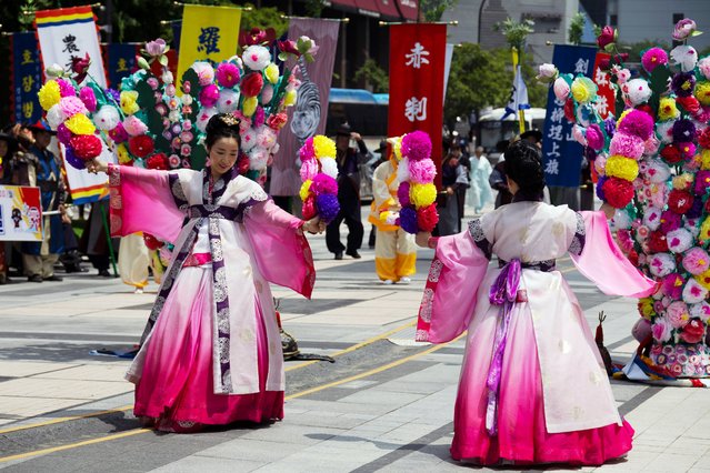 Members of Dano festival committees wearing Hanbok traditional clothing perform during a campaign for the upcoming Dano festival in Seoul, South Korea, 22 May 2024. South Korea will hold the Dano festival on 06 June. The Dano Festival was designated as a masterpiece of the Oral and Intangible Heritage of Humanity by UNESCO in 2005. (Photo by Jeon Heon-Kyun/EPA/EFE)