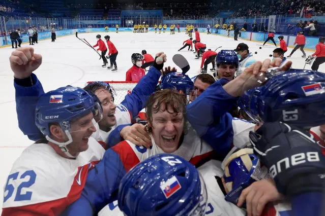 Michal Cajkovsky #65 of Team Slovakia celebrates a victory with their team after the Men's Ice Hockey Bronze Medal match between Team Sweden and Team Slovakia on Day 15 of the Beijing 2022 Winter Olympic Games at National Indoor Stadium on February 19, 2022 in Beijing, China. (Photo by Harry How/Getty Images)