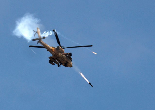 An Israeli military Apache helicopter fires missiles towards Gaza, amid the ongoing conflict between Israel and the Palestinian Islamist group Hamas, as seen from southern Israel on May 14, 2024. (Photo by Amir Cohen/Reuters)