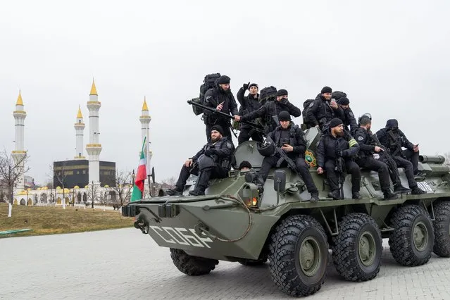 Servicemen take part in a review of the Chechen Republic's troops and military hardware at the residence of Ramzan Kadyrov, head of the Chechen Republic in Grozny, Chechen Republic, Russia on February 25, 2022. Early on 24 February, Russia's President Putin announced his decision to launch a special military operation after considering requests from the leaders of the Donetsk People's Republic and Lugansk People's Republic. (Photo by Yelena Afonina/TASS)