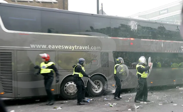 Britain Soccer Football, West Ham United vs Manchester United, Barclays Premier League, Old Trafford on May 10, 2016. Bottles are thrown at the Manchester United team bus before the match. (Photo by Eddie Keogh/Reuters/Livepic)
