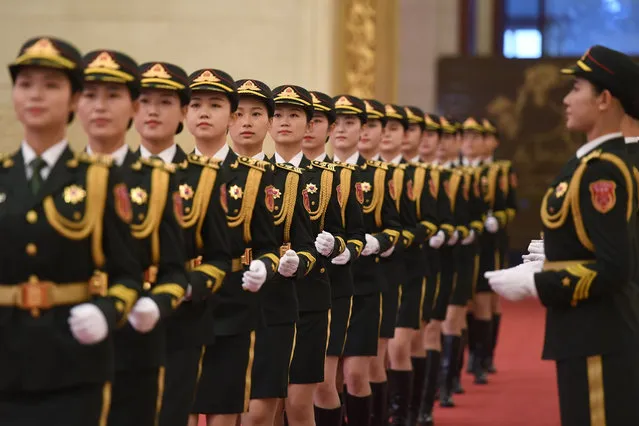 Chinese soldiers rehearse before an awards ceremony at Beijing's Great Hall of the People on September 29, 2019. Chinese President Xi Jinping awarded medals and honorary titles to an array of both domestic and international “heroes” on September 29, including a centenarian Canadian educator, and a former French prime minister. (Photo by Greg Baker/AFP Photo/Pool)