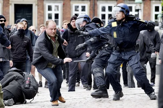 Protesters from the neo-Nazi party Danish National Socialist Movement (DNSB) and protestors from the left-wing group Racism Free City clash at Christiansborg Palace Square May 10, 2014. Police had to make several arrests. (Photo by Bax Lindhardt/AFP Photo)