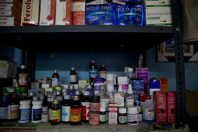 In this June 8, 2015 photo, medicine collected from people around Delhi, are arranged on shelves at a rented store room by Omkarnath, who goes by the name “Medicine Baba”, in New Delhi, India. (Photo by Saurabh Das/AP Photo)