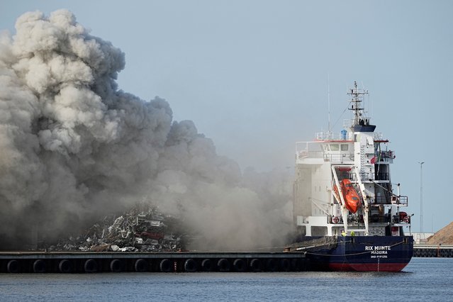 Smoke rises from a fire on a ship that has docked in Koege, Denmark, on Tuesday, April 30, 2024. (Photo by Mads Claus Rasmussen/Ritzau Scanpix via Reuters)