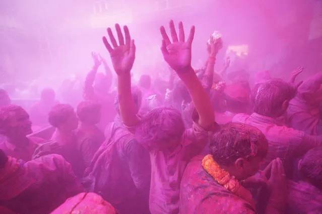 “Holi Festival”. Taken in Vrindavan, India, Indian pray, dance and sing during the Holi Festival, and the color powder flowing in whole city. Photo location: Vrindavan, India. (Photo and caption by Chan Kwok Hung/National Geographic Photo Contest)