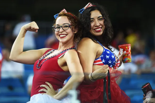 US fans cheer before a Group G football match between Ghana and US at the Dunas Arena in Natal during the 2014 FIFA World Cup on June 16, 2014. (Photo by Javier Soriano/AFP Photo)