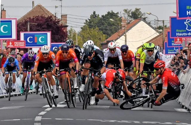 Team DSM's Australian Sam Welsford (C) sprints next to Human Powered Health's Dutch Arvid de Kleijn (C-L) as Lotto Soudal's Belgian Arnaud De Lie (2nd-R) and Arkea Samsic's British Daniel McLay (R) crash during the 161 km between Dunkirk and Aniche, first stage of the “4 jours de Dunkerque” (Four days of Dunkirk) cycling race, in Aniche northern France, on May 3, 2022. Dutch rider Arvid de Kleijn (Human Powered Health) was declared winner of the first stage of the Four Days of Dunkerque on May 3, 2022 in Aniche, after Australian rider Sam Welsford was dropped. Welsford (Team DSM) was the first to cross the line, but was considered responsible for the crash that sent Arnaud De Lie (Lotto Soudal) and Daniel McLay (Arkea Samsic) to the ground. (Photo by Francois Lo Presti/AFP Photo)