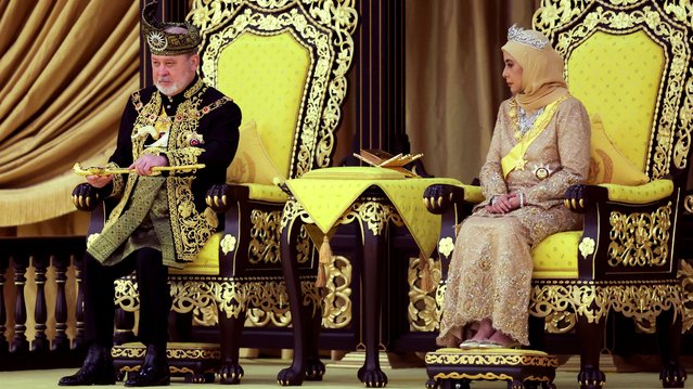 The seventeenth King of Malaysia, Sultan Ibrahim Sultan Iskandar, lifts a ceremonial dagger during his coronation at the National Palace in Kuala Lumpur on July 20, 2024. (Photo by Hasnoor Hussain/Pool via AFP Photo)