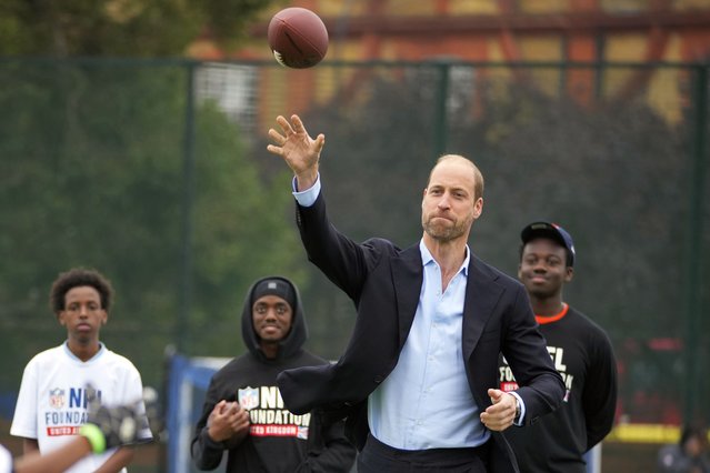 Britain's Prince William throws a football as he attends a NFL Foundation NFL Flag event, an inclusive and fast paced American Football format, in London, Tuesday, October 15, 2024. (Photo by Kin Cheung, Pool/AP Photo)