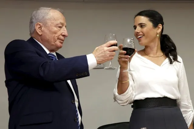 Ayelet Shaked (R), Israel's new Justice Minister of the far-right Jewish Home party, toasts with Attorney-General Yehuda Weinstein during a ceremony at the Justice Ministry in Jerusalem May 17, 2015. (Photo by Gali Tibbon/Reuters)