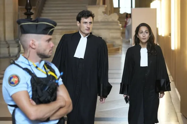 Salah Abdeslam's lawyers Olivia Ronen, right, and Martin Vettes arrive at the court room Wednesday, June 29, 2022 in Paris. Over the course of an extraordinary nine-month trial, the lone survivor of the Islamic State extremist team that attacked Paris in 2015 has proclaimed his radicalism, wept, apologized to victims and pleaded with judges to forgive his “mistakes”. For victims' families and survivors of the attacks, the trial for Salah Abdeslam and suspected accomplices has been excruciating yet crucial in their quest for justice and closure. At long last, the court will hand down its verdict Wednesday. (Photo by Michel Euler/AP Photo)