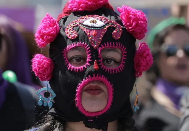 A woman participates in a march during International Women's Day in Ciudad Nezahualcoyotl, on the outskirts of Mexico City, Mexico on March 8, 2020. (Photo by Raquel Cunha/Reuters)