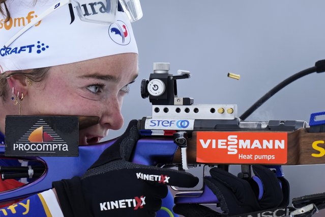An empty shell casing pops out of the rifle of Lou Jeanmonnot, of France, during the women's 10 km pursuit event at the Biathlon World Cup in Hochfilzen, Austria, Saturday, December 14, 2024. (Photo by Matthias Schrader/AP Photo)