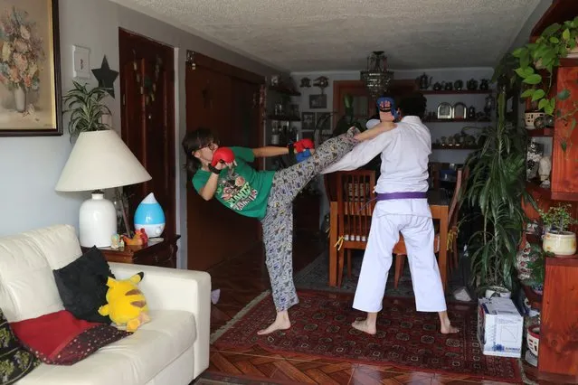 Alexis, a 15 years old transgender teenager and his twin sister Catalina train Karate while quarantining at home during the outbreak of coronavirus disease (COVID-19), in Santiago, Chile, April 21, 2020. (Photo by Pablo Sanhueza/Reuters)