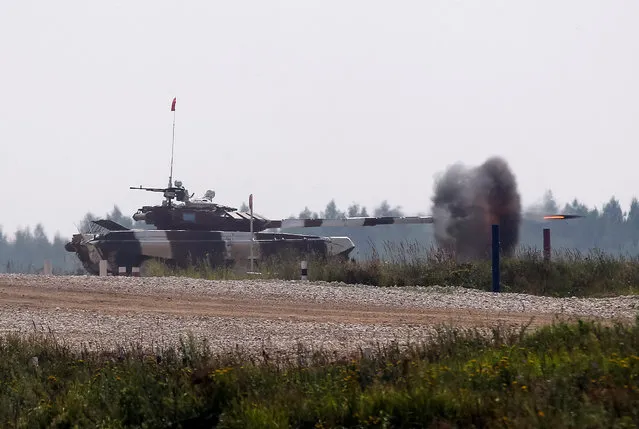 A tank fires at a target on the course of the Tank Biathlon competition during the International Army Games 2016 in Alabino, outside Moscow, Russia, July 30, 2016. (Photo by Maxim Zmeyev/Reuters)