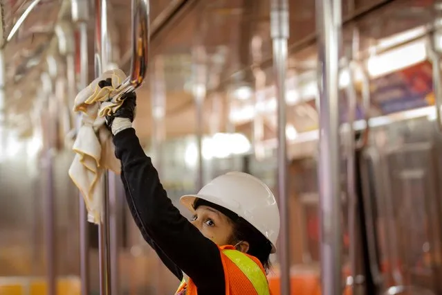 A New York City MTA transit worker cleans a subway car, during the outbreak of the coronavirus disease (COVID-19) in New York City, New York, U.S., May 4, 2020. (Photo by Brendan McDermid/Reuters)