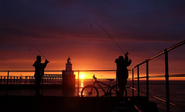 Fishing on the pier at dawn on the Northumberland coast, Blyth, England on September 20, 2017. (Photo by Owen Humphreys/PA Wire)