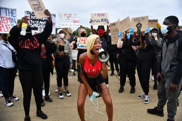 A woman shouts into a megaphone in Hyde Park during a “Black Lives Matter” protest following the death of George Floyd who died in police custody in Minneapolis, London, Britain, June 3, 2020. (Photo by Dylan Martinez/Reuters)