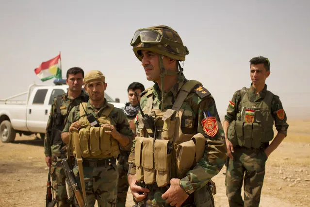 Lt. Col. Arshad Hussein with the 1st Zerevani Brigade at a small outpost outside the village of Qarqashah, Iraq in Monday, August 15, 2016. (Photo by Susannah George/AP Photo)