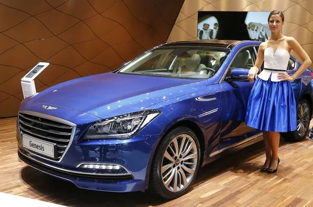 A model poses with the Hyundai Genesis car during the media day at the Frankfurt Motor Show (IAA) in Frankfurt, Germany, September 15, 2015. (Photo by Kai Pfaffenbach/Reuters)