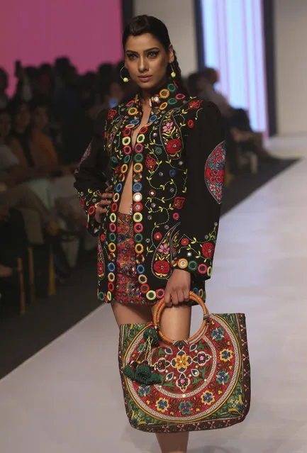 A model presents a creation of designer Deepak Perwani during the “Fashion Pakistan Week” in Karachi, Pakistan, Friday, November 10, 2017. (Photo by Shakil Adil/AP Photo)
