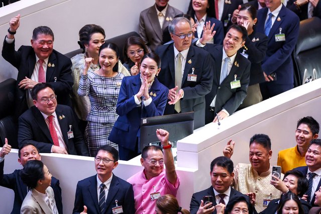 Thailand's Prime Minister Paetongtarn Shinawatra poses with coalition party members after the result of a no-confidence vote, which she faced in parliament in Bangkok, Thailand, on March 26, 2025. (Photo by Athit Perawongmetha/Reuters)