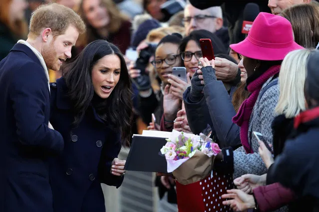 Prince Harry and Meghan Markle interact with crowd as they visit Nottingham Contemporary on December 1, 2017 in Nottingham, England. Prince Harry and Meghan Markle announced their engagement on Monday 27th November 2017 and will marry at St George's Chapel, Windsor in May 2018. (Photo by Christopher Furlong/Getty Images)