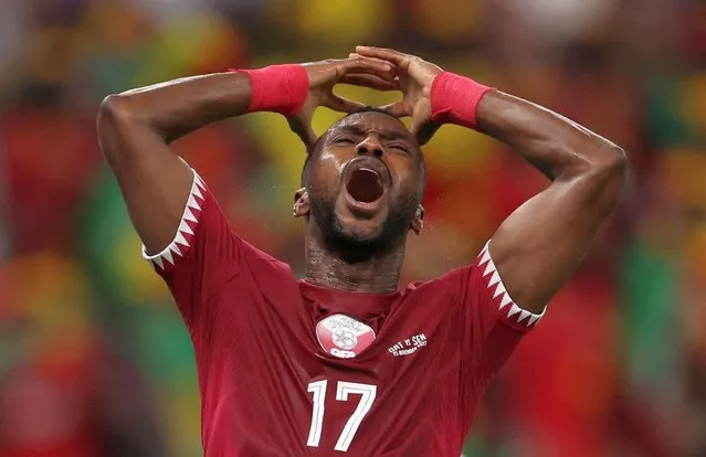 Qatar's defender #17 Ismaiel Mohammed reacts during the Qatar 2022 World Cup Group A football match between Qatar and Senegal at the Al-Thumama Stadium in Doha on November 25, 2022. (Photo by Amr Abdallah Dalsh/Reuters)