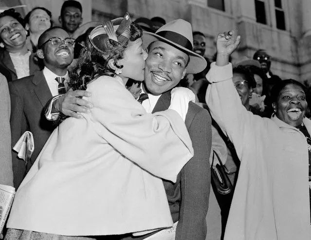 The Rev. Martin Luther King Jr. is welcomed with a kiss by his wife Coretta after leaving court in Montgomery, Ala., March 22, 1956. King was found guilty of conspiracy to boycott city buses in a campaign to desegregate the bus system, but a judge suspended his $500 fine pending appeal. (Photo by Gene Herrick/AP Photo)