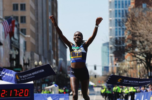 Sharon Lokedi of Kenya crosses the finish line of the 129th Boston Marathon on April 21, 2025, on Boylston Street, in Boston, MA. Lokedi won the women's open division with a time of 2:17:22 and broke the course record. (Photo by Brian Snyder/Reuters)