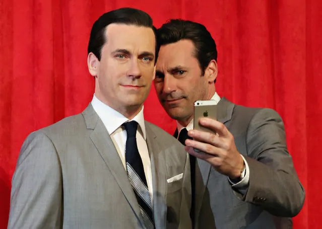 Actor Jon Hamm takes a selfie as he unveils Don Draper's wax figure during Mad Men's Final Season at Madame Tussauds New York on May 9, 2014 in New York City. (Photo by Cindy Ord/Getty Images for Madame Tussauds)