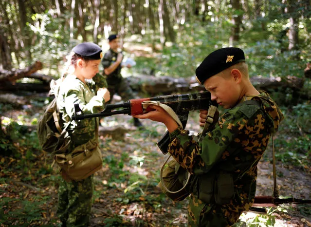 Fifth-grade students of the General Yermolov Cadet School take part in their first military tactical exercise on the ground, which includes radiation resistance classes, forest survival studies and other activities, in Stavropol, Russia, September 10, 2016. (Photo by Eduard Korniyenko/Reuters)