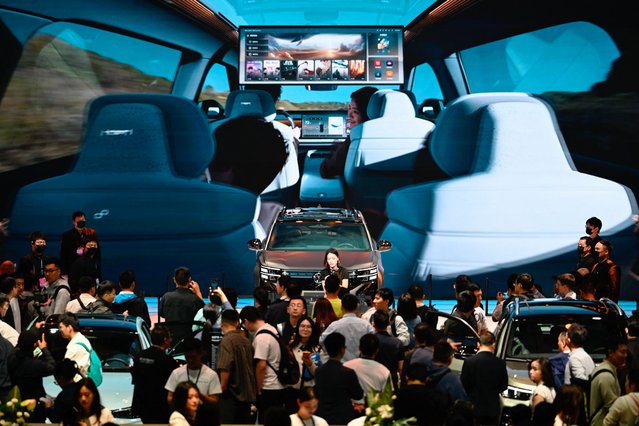 People visit the 21st Shanghai International Automobile Industry Exhibition at the National Exhibition and Convention Center in Shanghai on April 25, 2025. (Photo by Wang Zhao/AFP Photo)