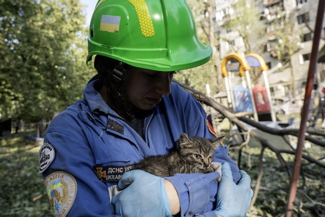 A female rescuer holds an injured kitten found at the site of a Russian ballistic missile strike on a residential building during a massive overnight attack in Kyiv, Ukraine, on June 17, 2025. According to preliminary reports, 15 people are killed and 114 are injured. Russia launches 440 attack drones and 32 cruise and ballistic missiles across Ukraine during the strike. (Photo by Maxym Marusenko/NurPhoto via Getty Images)