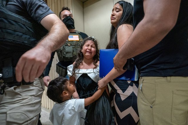 A child weeps as her father is mistakenly detained by federal immigration officers at U.S. immigration court in Manhattan, in New York City on June 30, 2025. (Photo by David 'Dee' Delgado/Reuters)