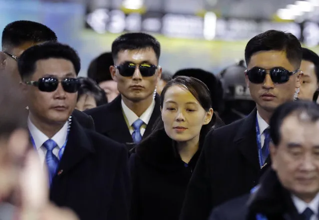 North Korean leader Kim Jong Un's younger sister Kim Yo Jong, center, arrives at the Jinbu train station in Pyeongchang, South Korea, Friday, February 9, 2018. In a stunning turn of events, North Korean leader Kim Jong Un's younger sister arrived in South Korea on Friday to be her brother's special envoy to the Pyeongchang Winter Olympics. (Photo by Lee Jin-man/AP Photo)