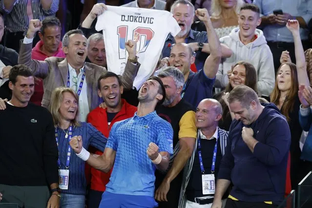 Novak Djokovic of Serbia, center, celebrates with his team including his mother, Dijana, second left, after defeating Stefanos Tsitsipas of Greece in the men's singles final at the Australian Open tennis championships in Melbourne, Australia, Sunday, January 29, 2023. (Photo by Asanka Brendon Ratnayake/AP Photo)