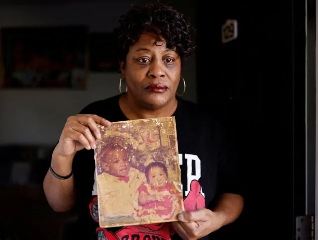 Sonya Williams, mother of Darryl Tyree Williams, poses for a portrait holding a thirty-one-year-old photograph of her son Darryl and daughter Arviette after authorities released video showing events that led to the death of the unarmed Black man repeatedly tasered by Raleigh police last month, at her home in Wendell, North Carolina, U.S., February 14, 2023. (Photo by Jonathan Drake/Reuters)
