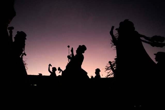 Dancers partake in an event marking the anniversary of the 1973 military coup that toppled the government of late President Salvador Allende, in Santiago, Chile, Thursday, September 11, 2025. (Photo by Esteban Felix/AP Photo)
