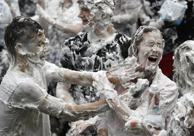 Students from St Andrews University are covered in foam as they take part in the traditional “Raisin Weekend” in the Lower College Lawn, at St Andrews in Scotland, Britain October 17, 2016. (Photo by Russell Cheyne/Reuters)