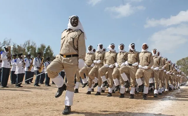 Somali police march at police academy compound during  their 71st anniversary in Mogadishu, Somalia, Saturday, December 20, 2014. (Photo by Farah Abdi Warsameh/AP Photo)