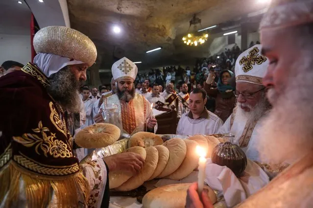 Coptic Christians attend Orthodox Christmas Eve Mass in the Cave Cathedral or St. Sama'ans Church on the Mokattam hills overlooking Cairo, Egypt, Tuesday, January 6, 2015. The Coptic Christian population are considered to be the largest Christian community in the Middle East and observe Christmas on January 7 according to the old, Julian calendar. (Photo by Mosa'ab Elshamy/AP Photo)