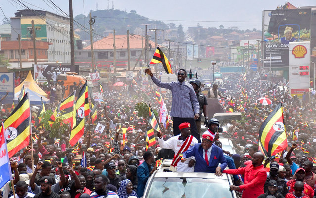Ugandan Presidential candidate Robert Kyagulanyi, also known as Bobi Wine, of the National Unity Platform (NUP) party, waves to supporters as he campaigns ahead of the general elections in Kampala, Uganda on November 24, 2025. (Photo by Abubaker Lubowa/Reuters)