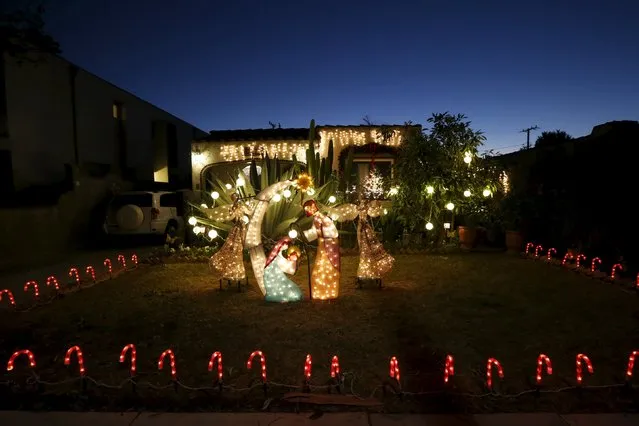 A Christmas nativity scene is seen in the yard of a home in Los Angeles, California, United States, December 15, 2015. (Photo by Lucy Nicholson/Reuters)