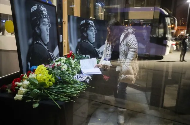 A makeshift memorial set up outside the Yubileyny Sports Palace in tribute to the late Junior Hockey League player Timur Faizutdinov in St Petersburg, Russia on March 16, 2021. The 19-year-old Dynamo St Petersburg captain took a hit to the head with a puck during their March 12 match against Lokomotiv Yaroslav and was admitted to intensive care, but succumbed to the injury four days later. (Photo by Peter Kovalev/TASS)