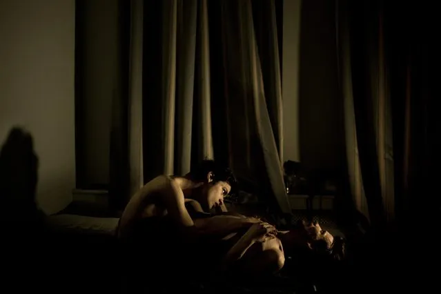 Mads Nissen, a Danish staff photographer for the Danish daily newspaper Politiken and represented by Panos Pictures, won the World Press Photo of the Year 2014 contest with this image of Jon and Alex, a gay couple, during an intimate moment in St. Petersburg, Russia, in this picture released by the World Press Photo on February 12, 2015. (Photo by Mad Nissen/Reuters/Politiken/Panos Pictures/Scanpix/World Press Photo)