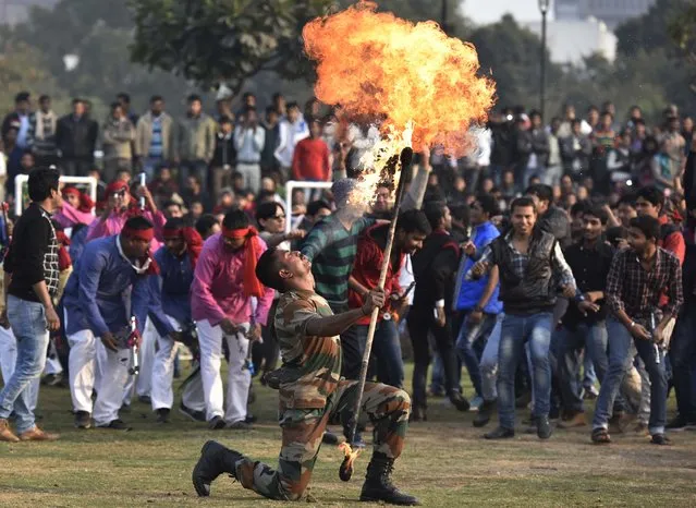 Indian Army Soldiers perform stunts and display their skills during a performnace in public in the wake of Indian Army Day at Central Park, Connaught Place on January 10, 2016 in New Delhi, India. (Photo by Raj K Raj/Hindustan Times via Getty Images)