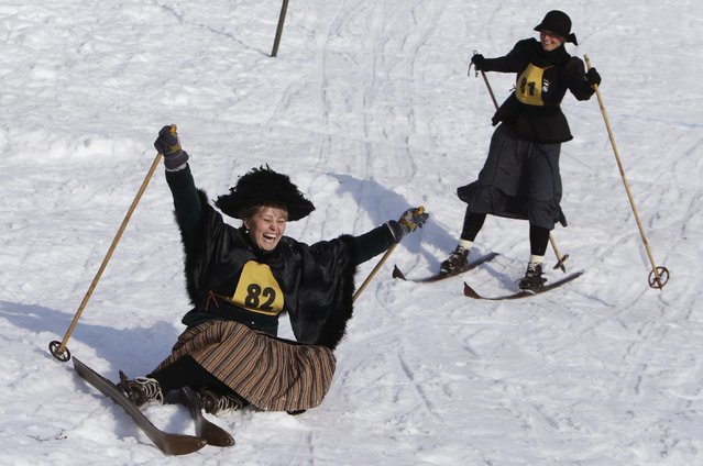 Participants compete on vintage skis during a traditional historical ski race in the northern Bohemian town of Smrzovka February 21, 2015. (Photo by David W. Cerny/Reuters)